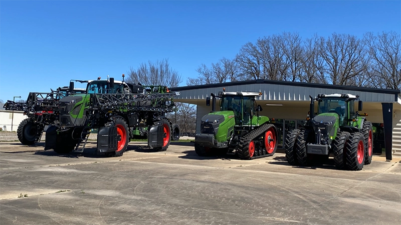 A lineup of Fendt agricultural equipment, including tractors and sprayers, on display at Delta Ag Equipment.